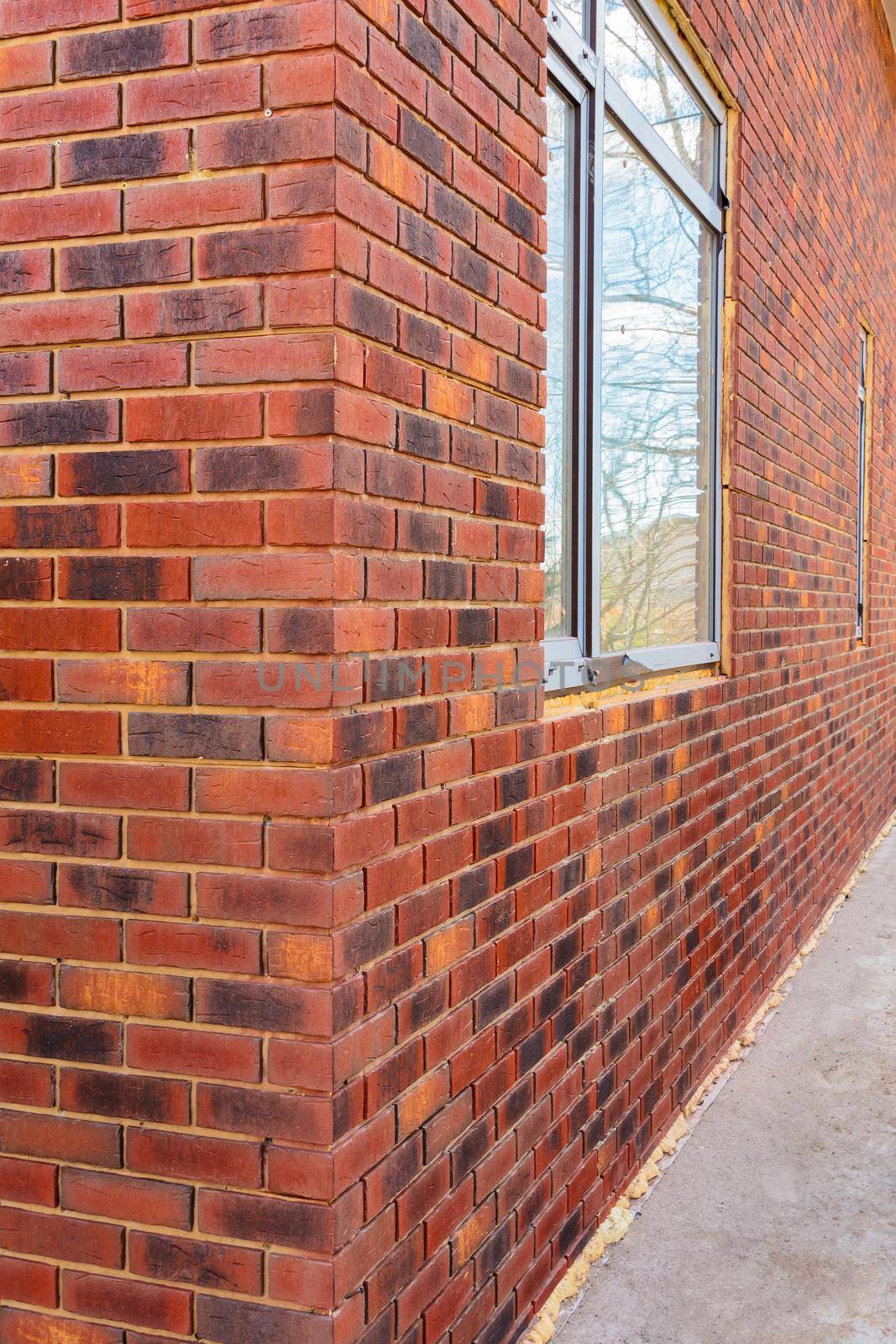 Clinker brick of brown color. Clinker thermal panels for finishing the facade of the house. Tiles for outdoor decoration