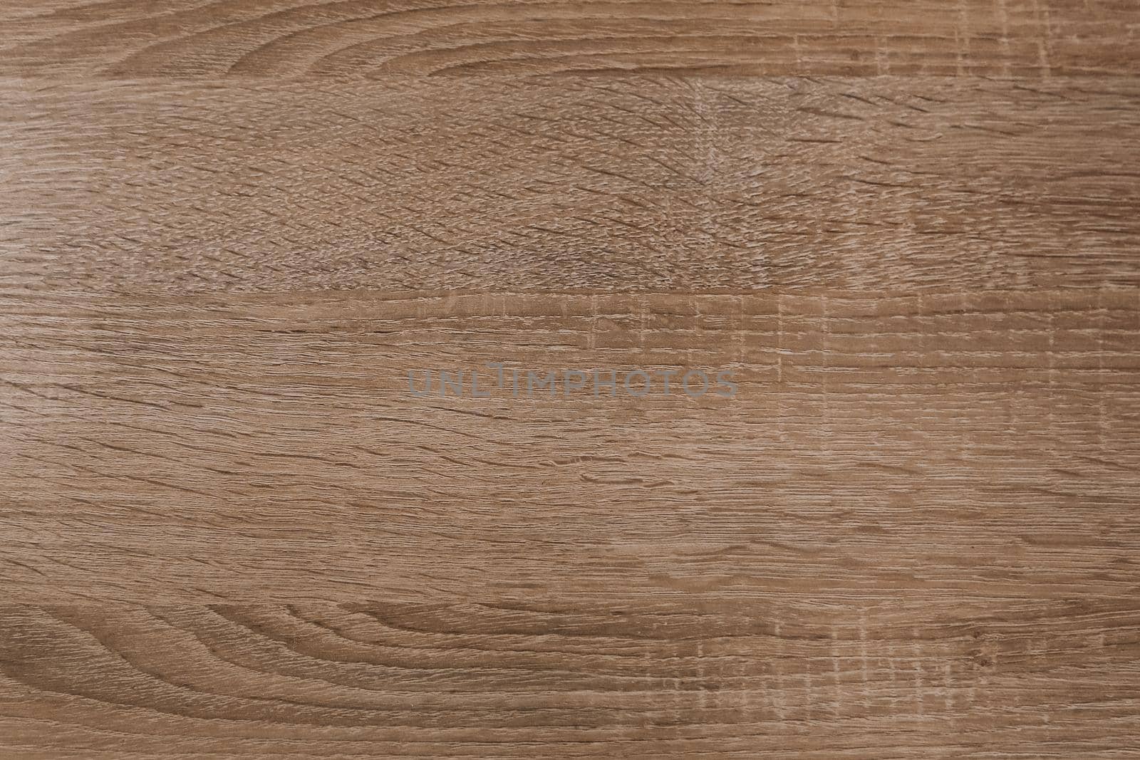 The background of the board is ash wood light yellow with a beautiful texture. Close-up of the cut.