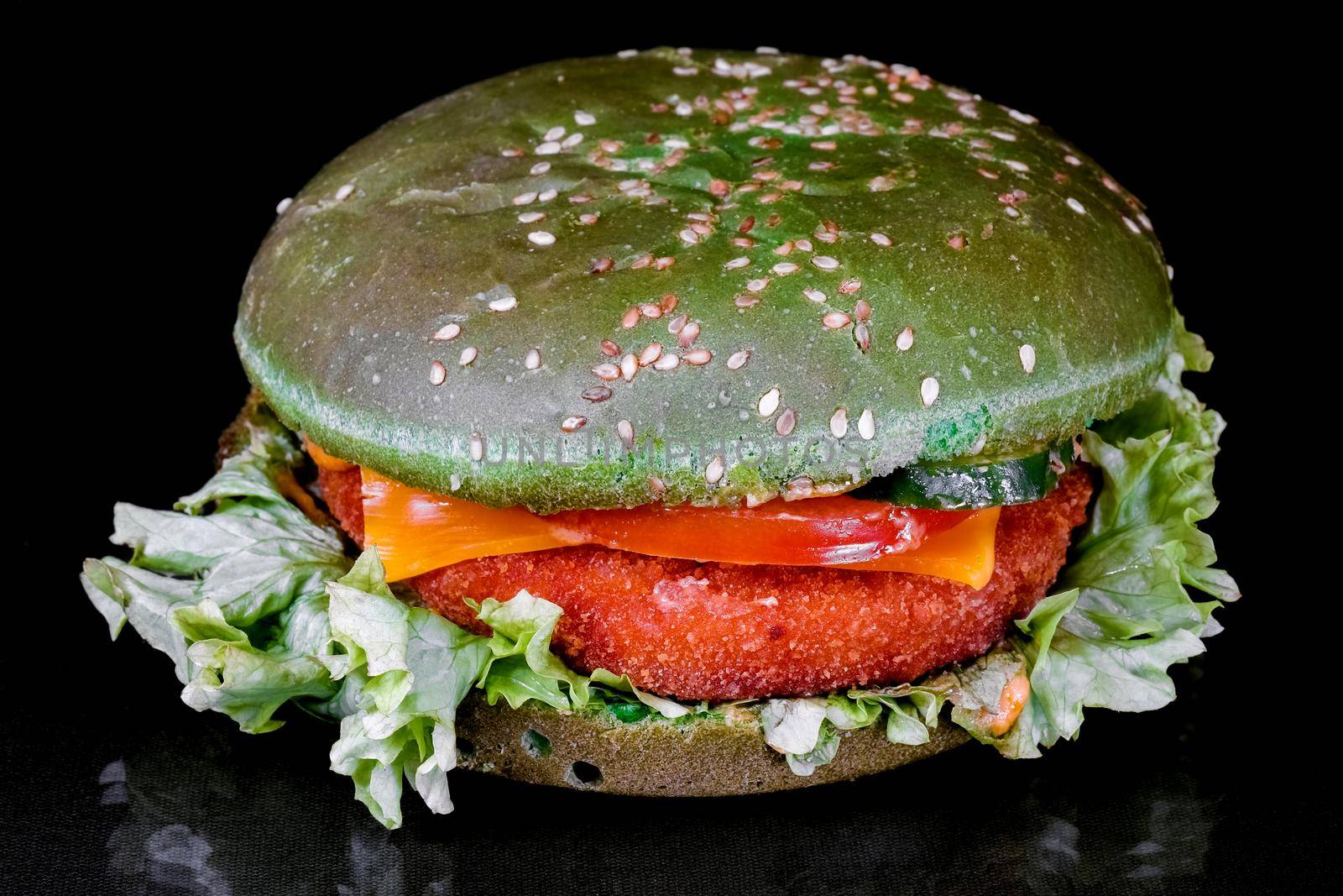 green hamburger on a black background macro by roman112007