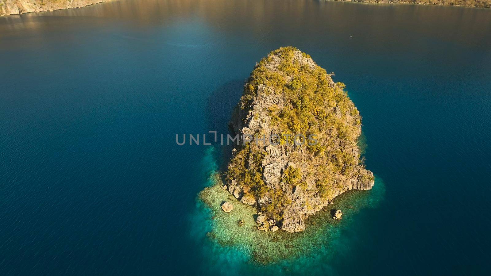 Aerial view: beach, tropical island, sea bay and lagoon, Palawan. Lagoon with blue, azure water in the middle of small islands and rocks. Busuanga. Seascape, tropical landscape. Philippines.