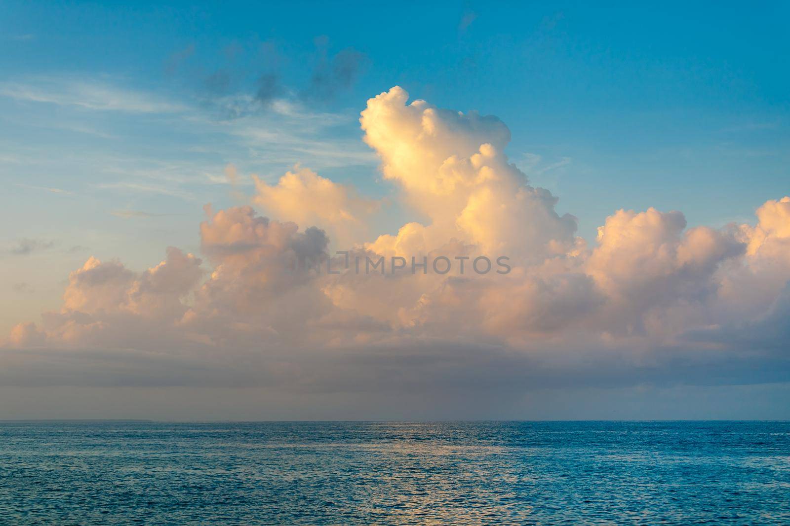 Beautiful sea Sunny landscape on the beach. Light waves of blue color spread all over the beach smoothly smoothing the Golden sand.