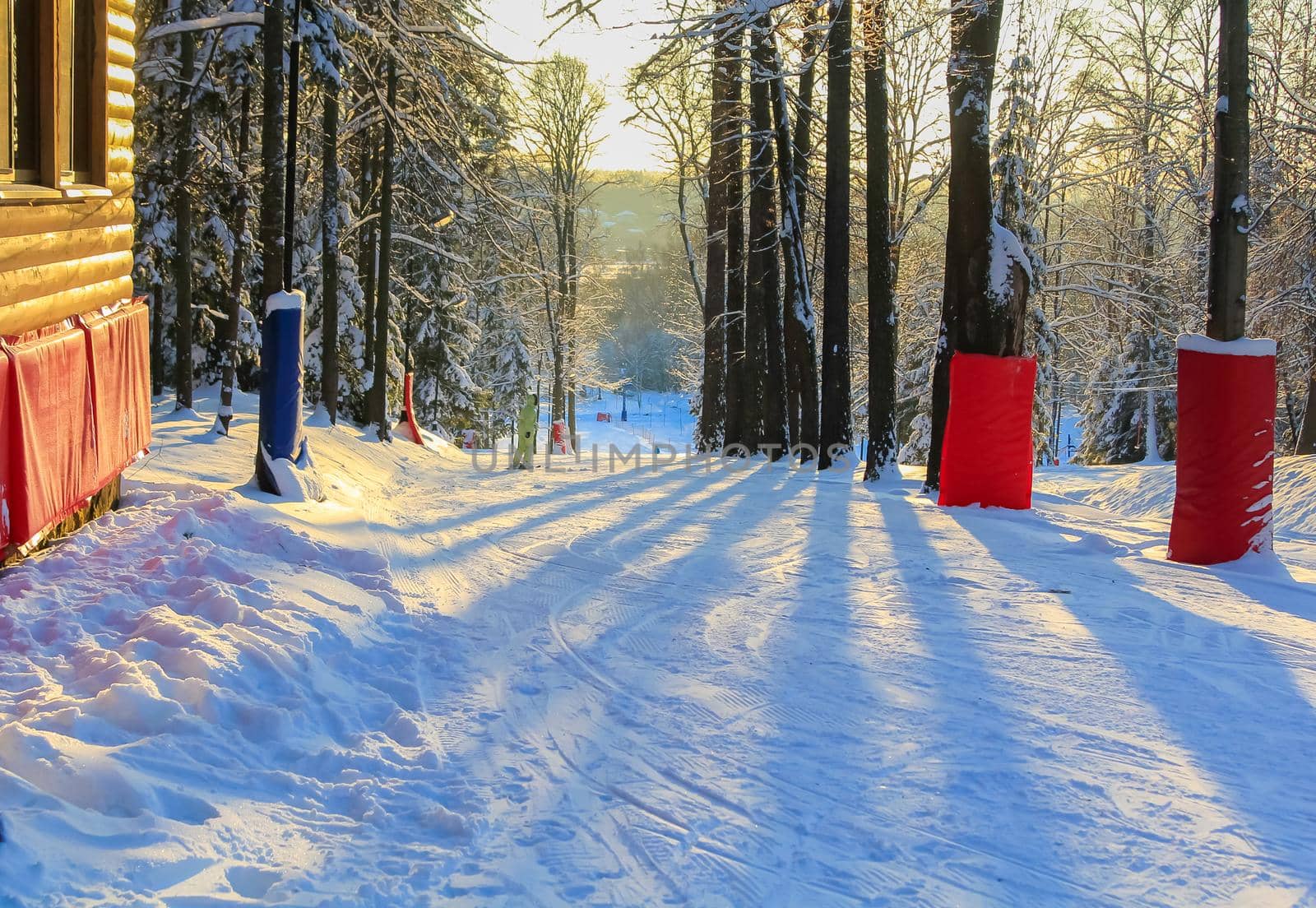 A man is riding in the sun at a ski resort. Active recreation concept