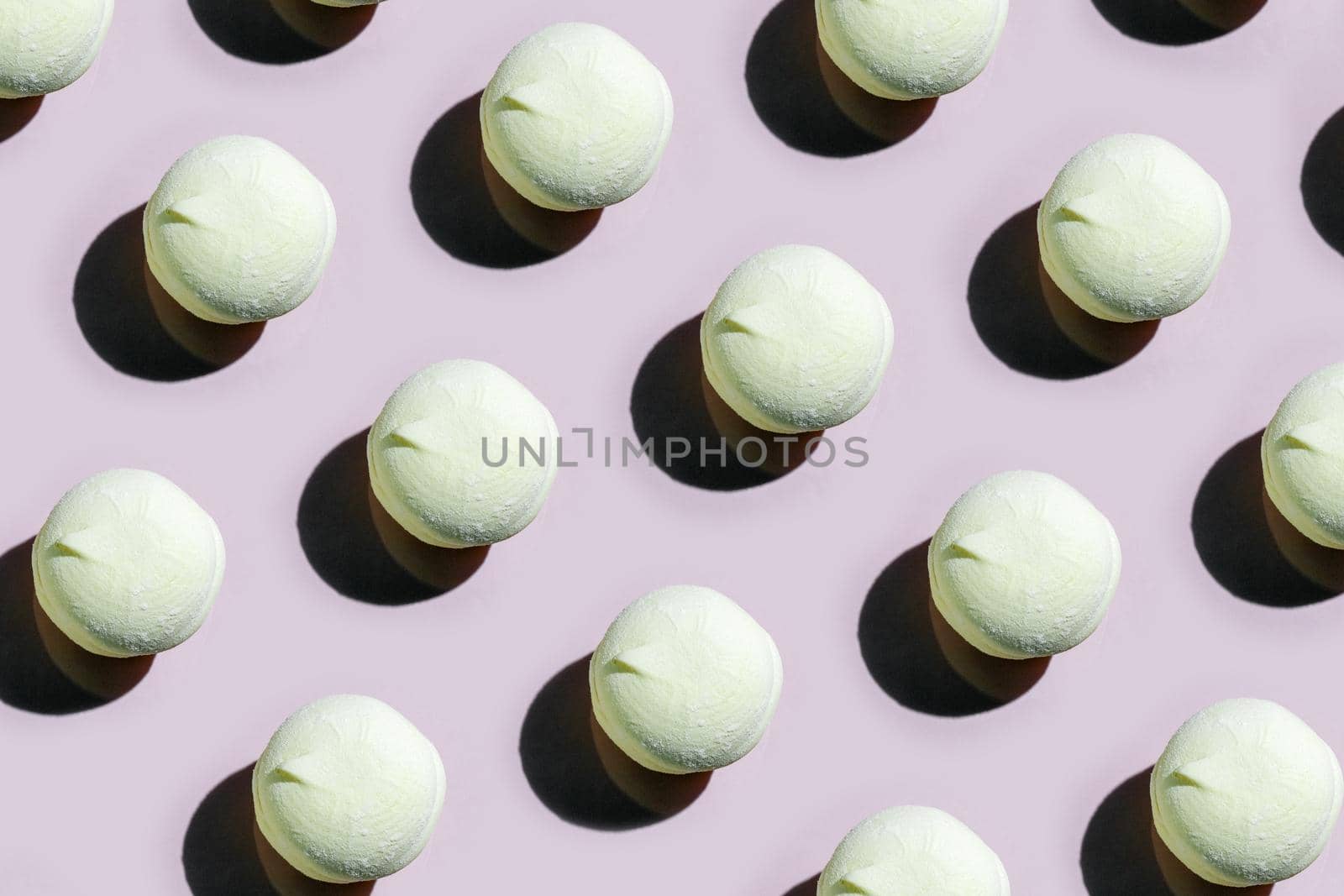 colorful marshmallow pattern on a colored background top view. High quality photo