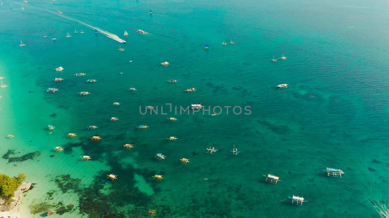 White sandy beach with tourists and hotels in Boracay Island, Philippines. aerial view. Seascape with beach on tropical island. Summer and travel vacation concept.