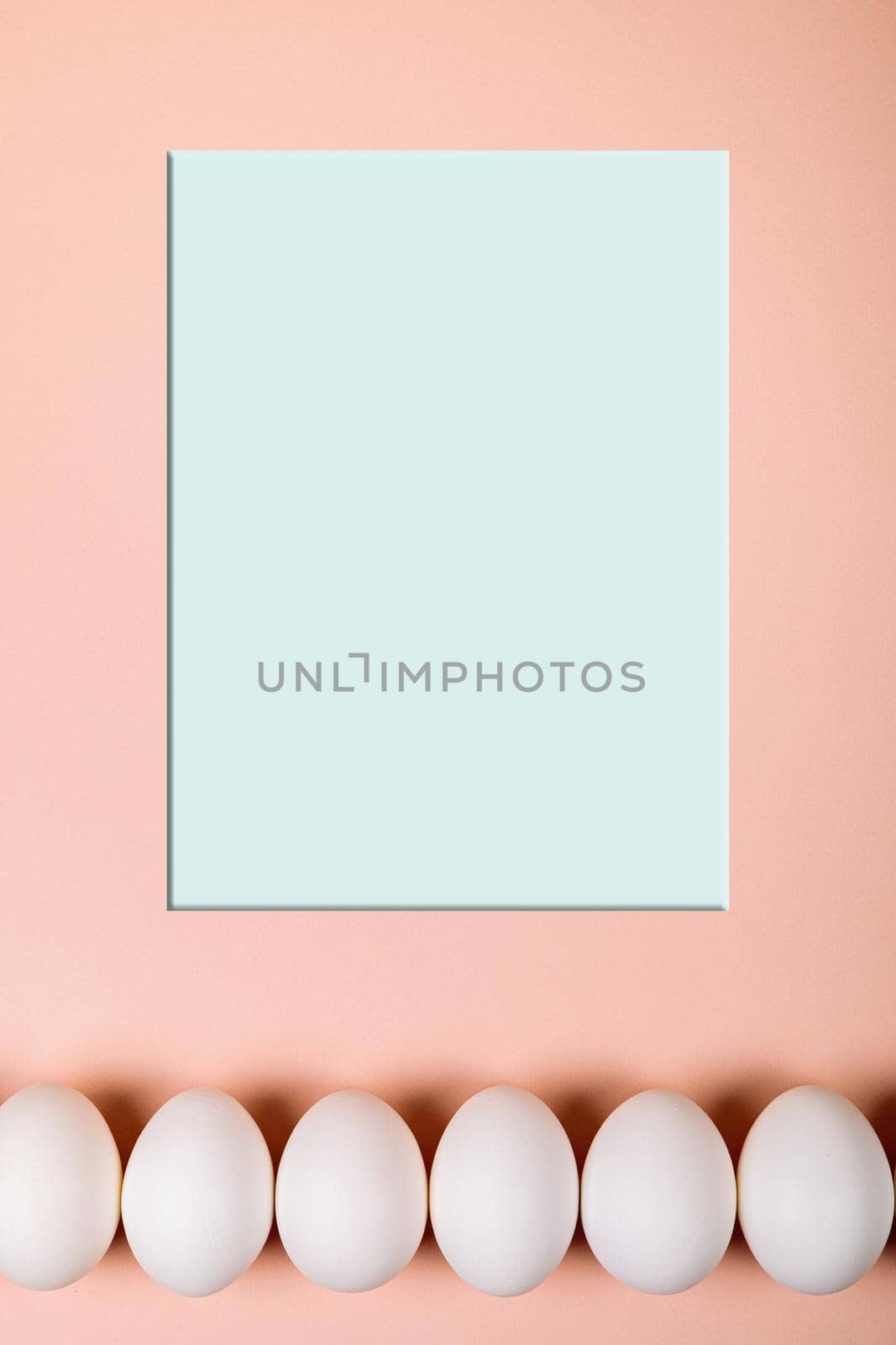 Easter eggs white on a pink background with place for text. Various compositions in a row, top, side, bottom.
