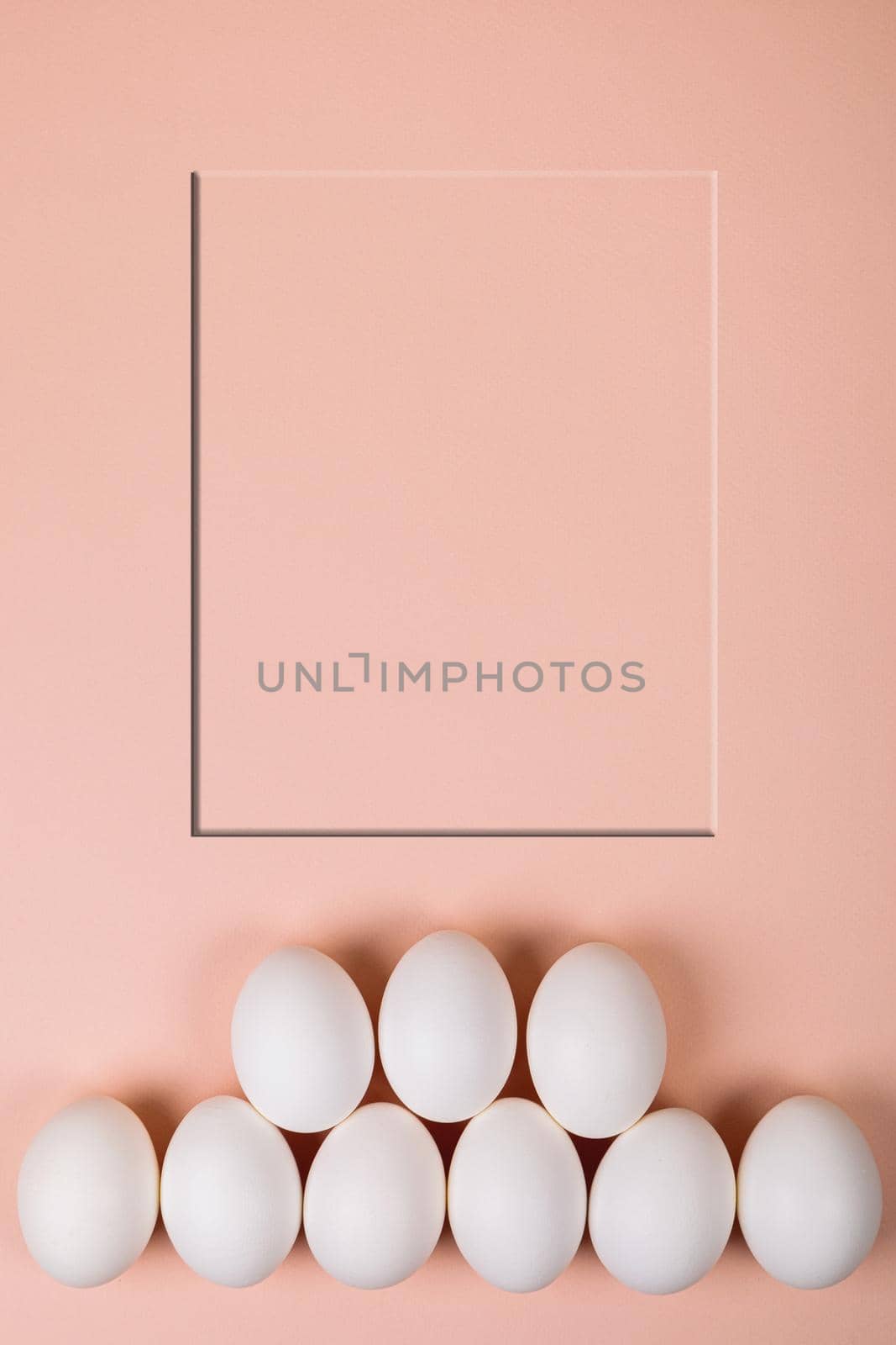 Easter eggs white on a pink background with place for text. Various compositions in a row, top, side, bottom.