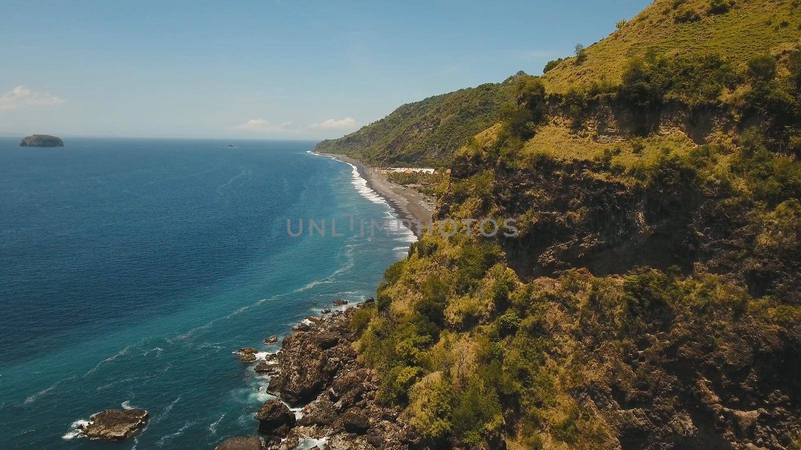 Aerial view sea coast, ocean, mountains, sea, beach, sky, clouds. Bali, Indonesia Seascape with Seashore on the background of mountains