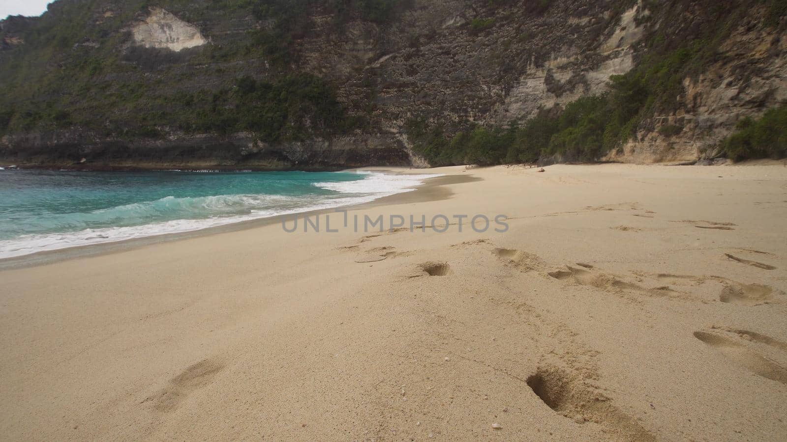 Tropical beach with turquoise water among the rocks, Karang Dawa, Nusa Penida Island, Bali, Indonesia. Travel concept.