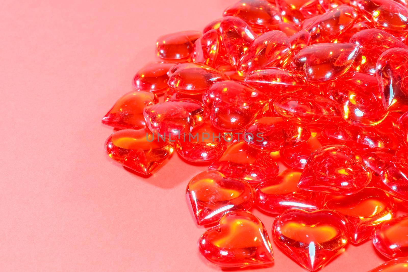 glass red hearts on a red background for Valentine's day. High quality photo