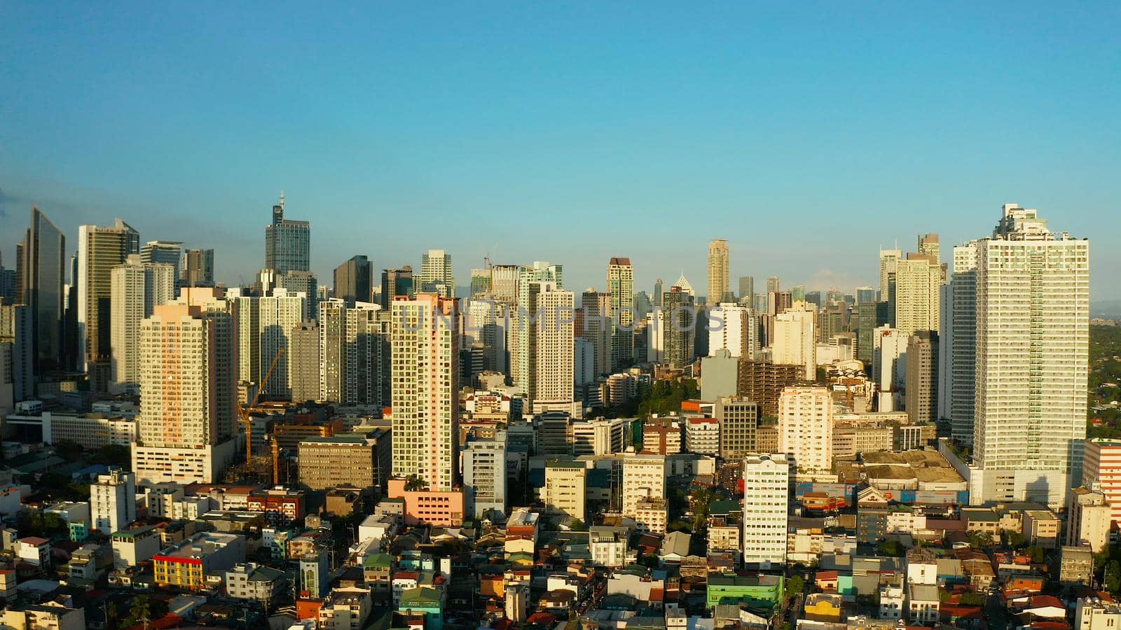 The city of Manila, the capital of the Philippines. Modern metropolis, top view. Modern buildings in the city center.