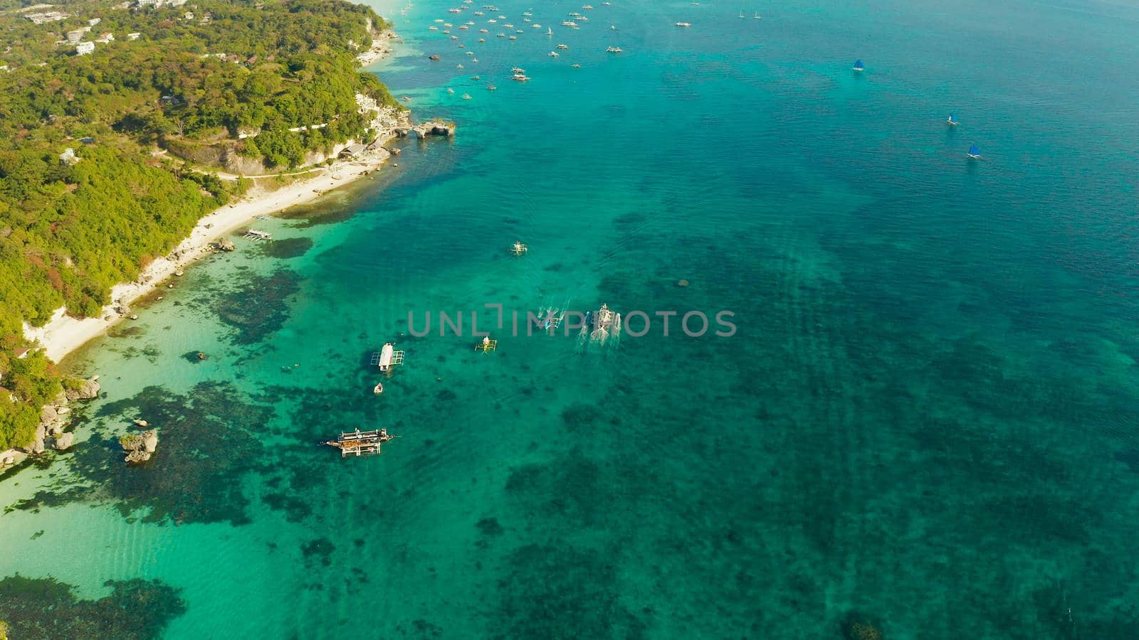 White sandy beach with tourists and hotels in Boracay Island, Philippines. aerial view. Seascape with beach on tropical island. Summer and travel vacation concept.