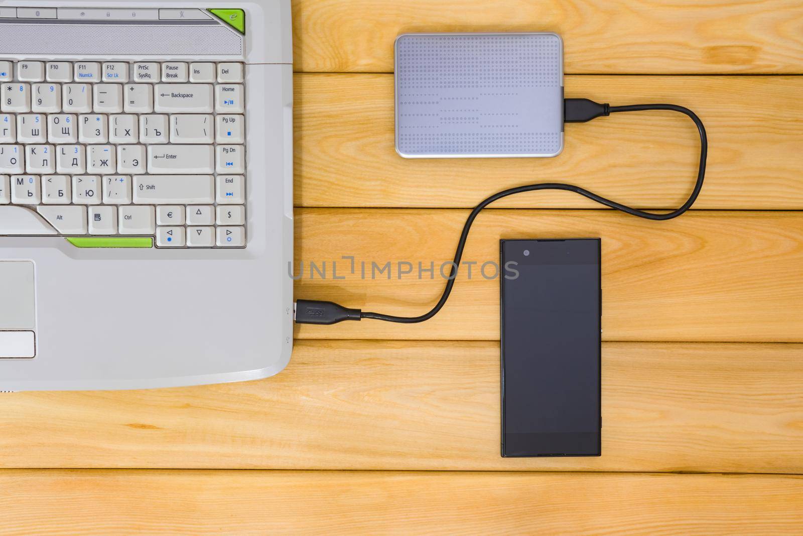 laptop on a wooden background top view. High quality photo