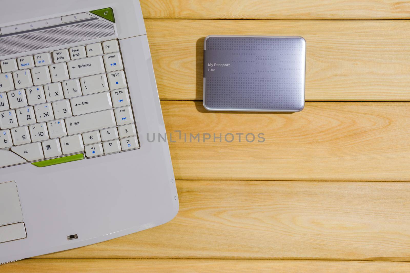 laptop on a wooden background top view by roman112007