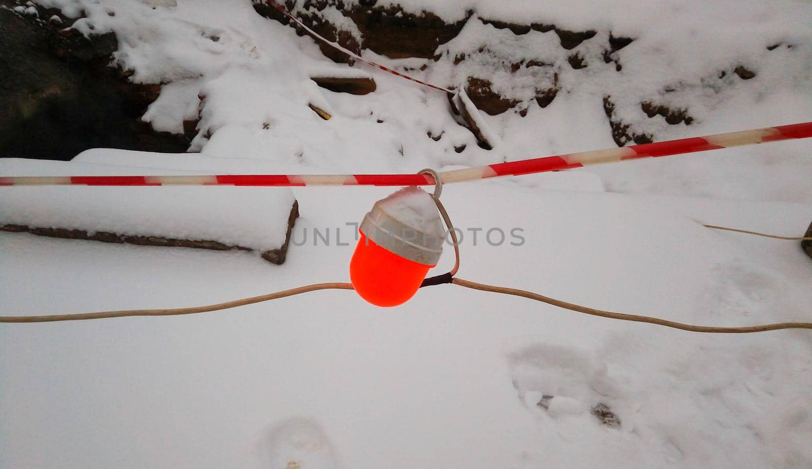 A red flashlight hangs near the place where repairs are being made by lapushka62