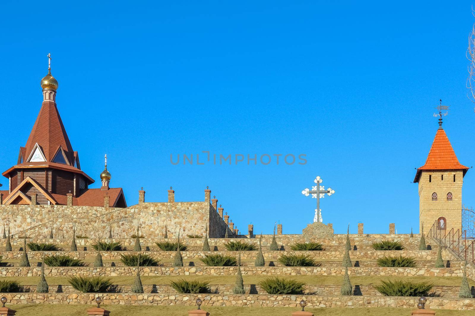 Church and cross against the blue sky. High quality photo