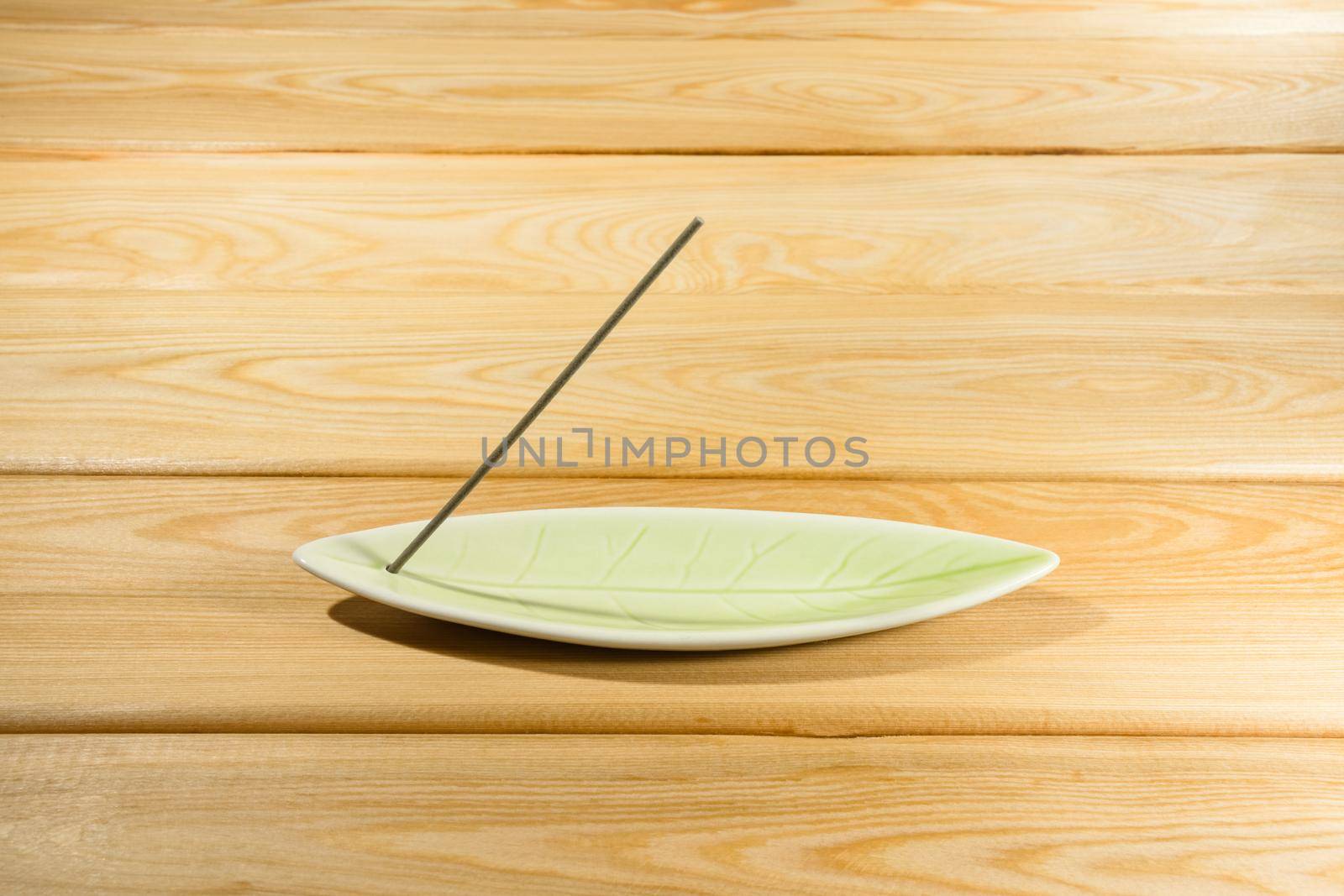 incense sticks on a wooden background isolate. High quality photo