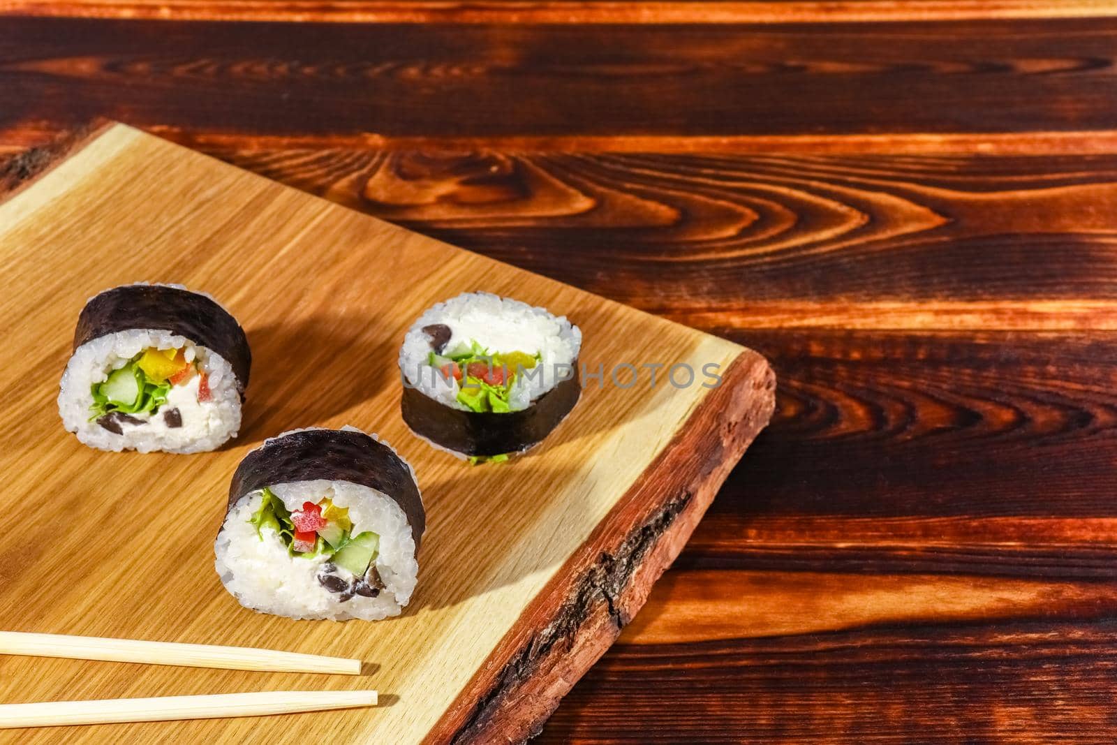 sushi on a wooden background close up by roman112007