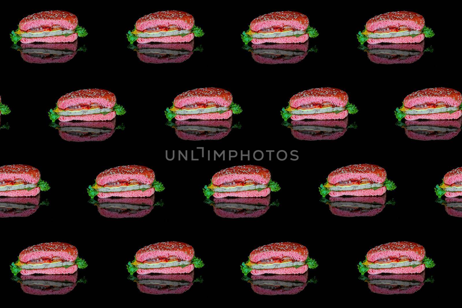 colorful pattern of a red hamburger on a black background top view. High quality photo