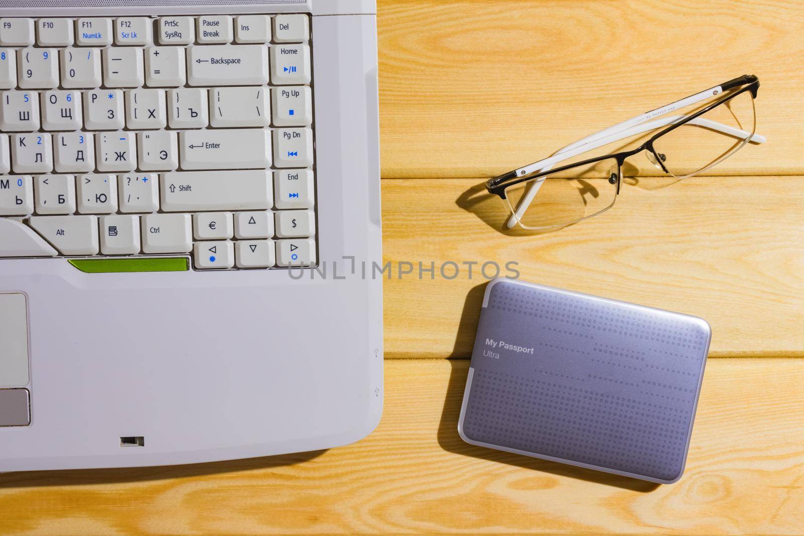 laptop on a wooden background top view. High quality photo
