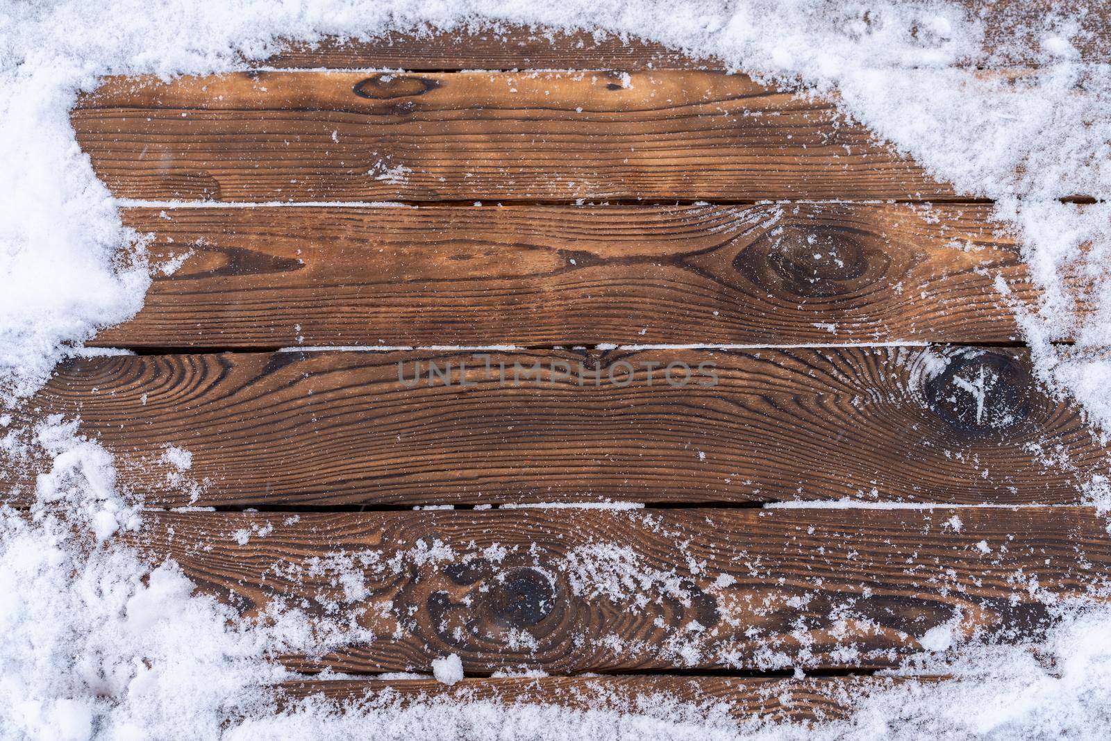 Winter background. Empty wooden plank with snowy border, copy space for text Wood table. For product display Christmas time mock up