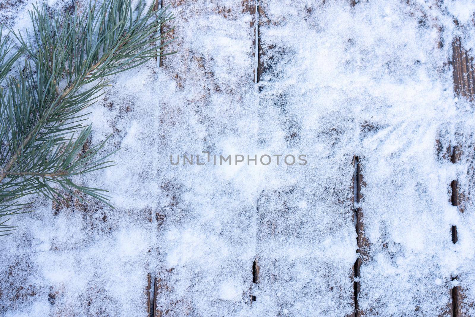 Winter background. Empty wooden plank with snowy border with pine branch and christmas ball decoration, copy space for text Wood table to. For product display Christmas time mock up