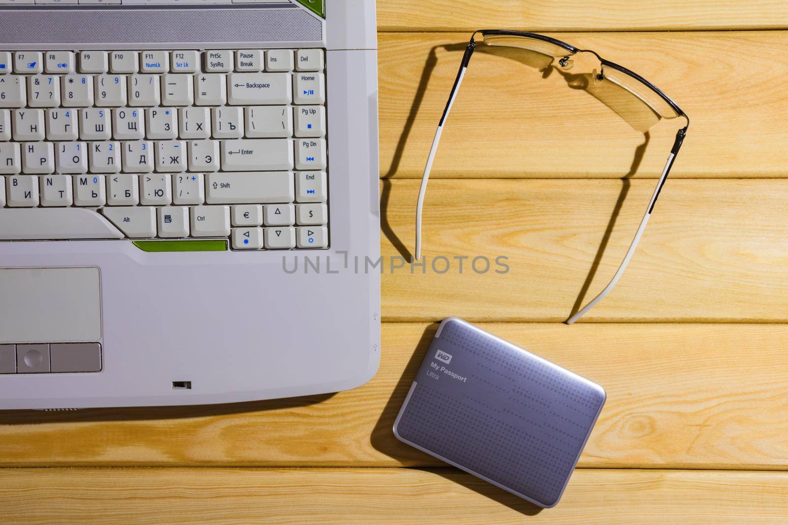 laptop on a wooden background top view. High quality photo