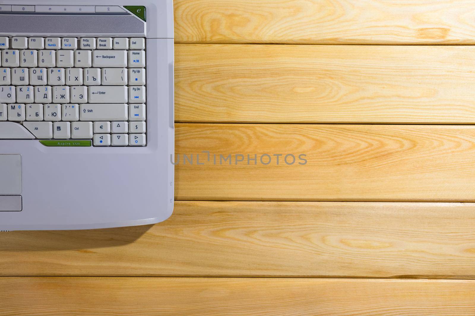 laptop on a wooden background top view by roman112007