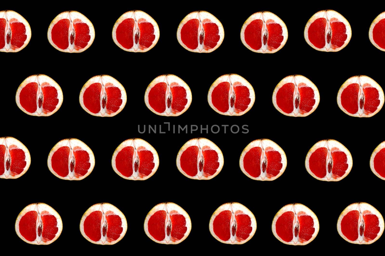 colorful grapefruit pattern on black background top view. High quality photo