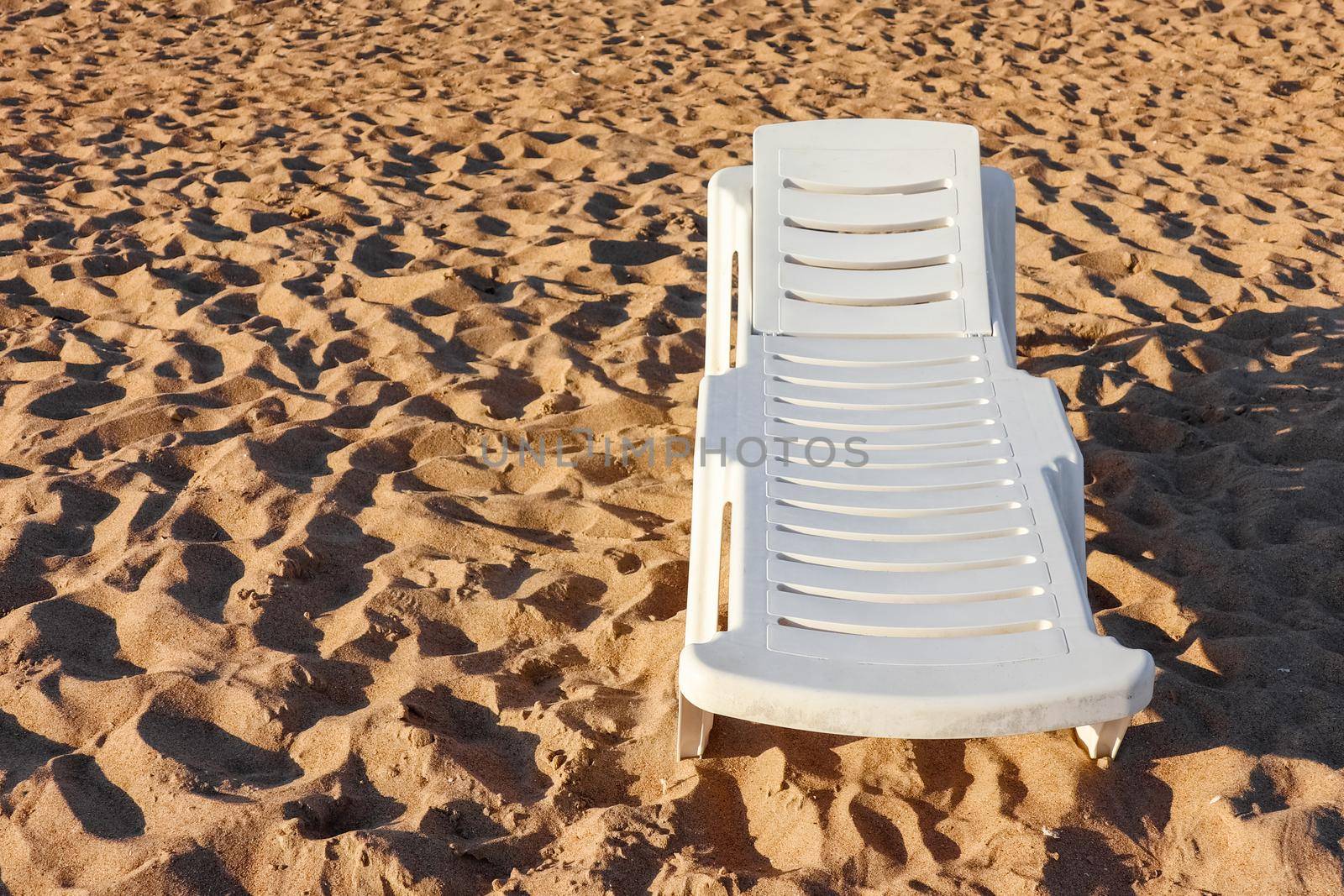 beach sunbed on the dune sand with a place for writing by roman112007