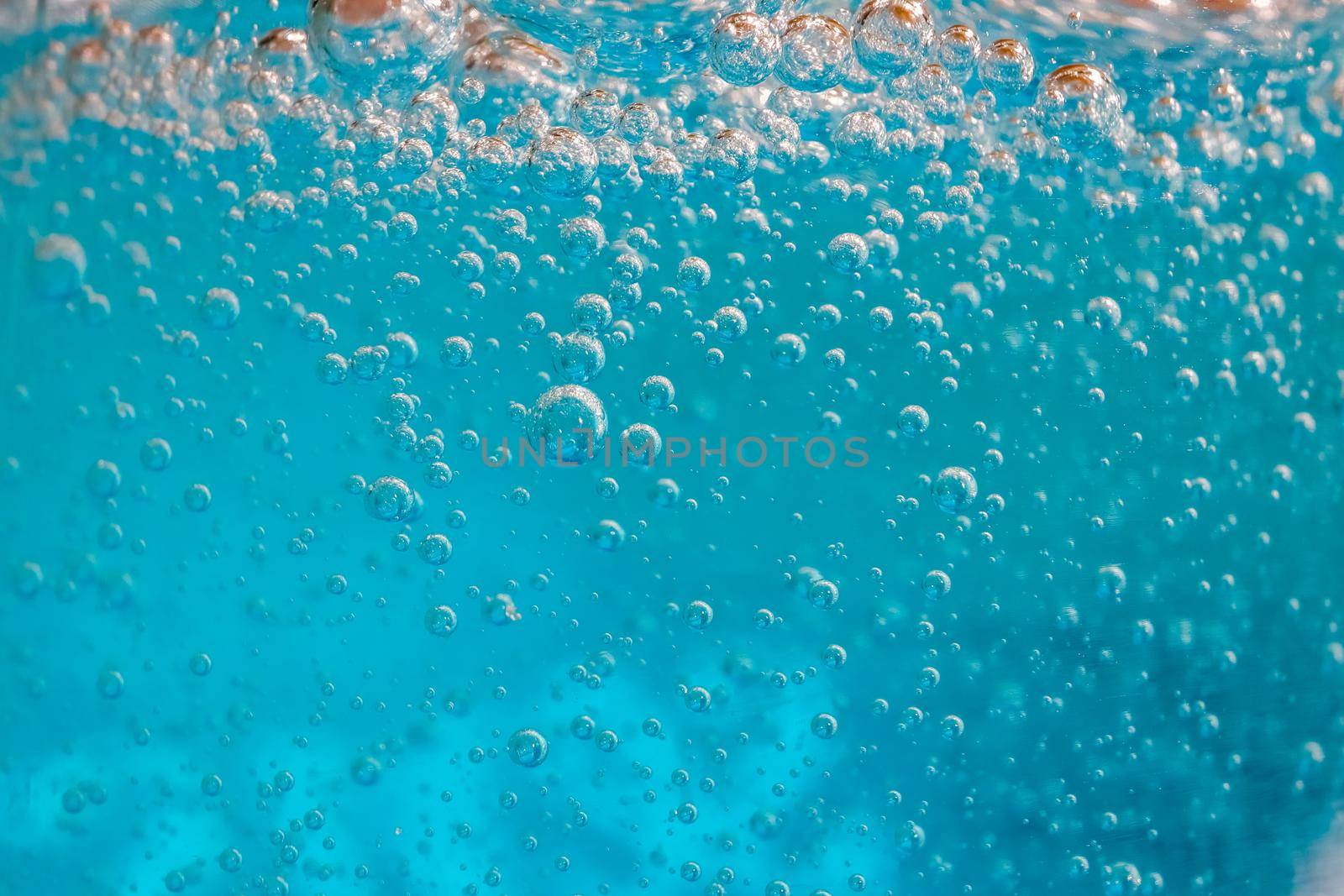 air bubbles in blue shampoos as background. High quality photo