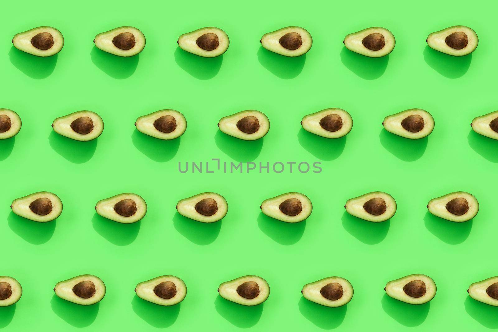 avocado color on a solid background, the top view pattern. High quality photo