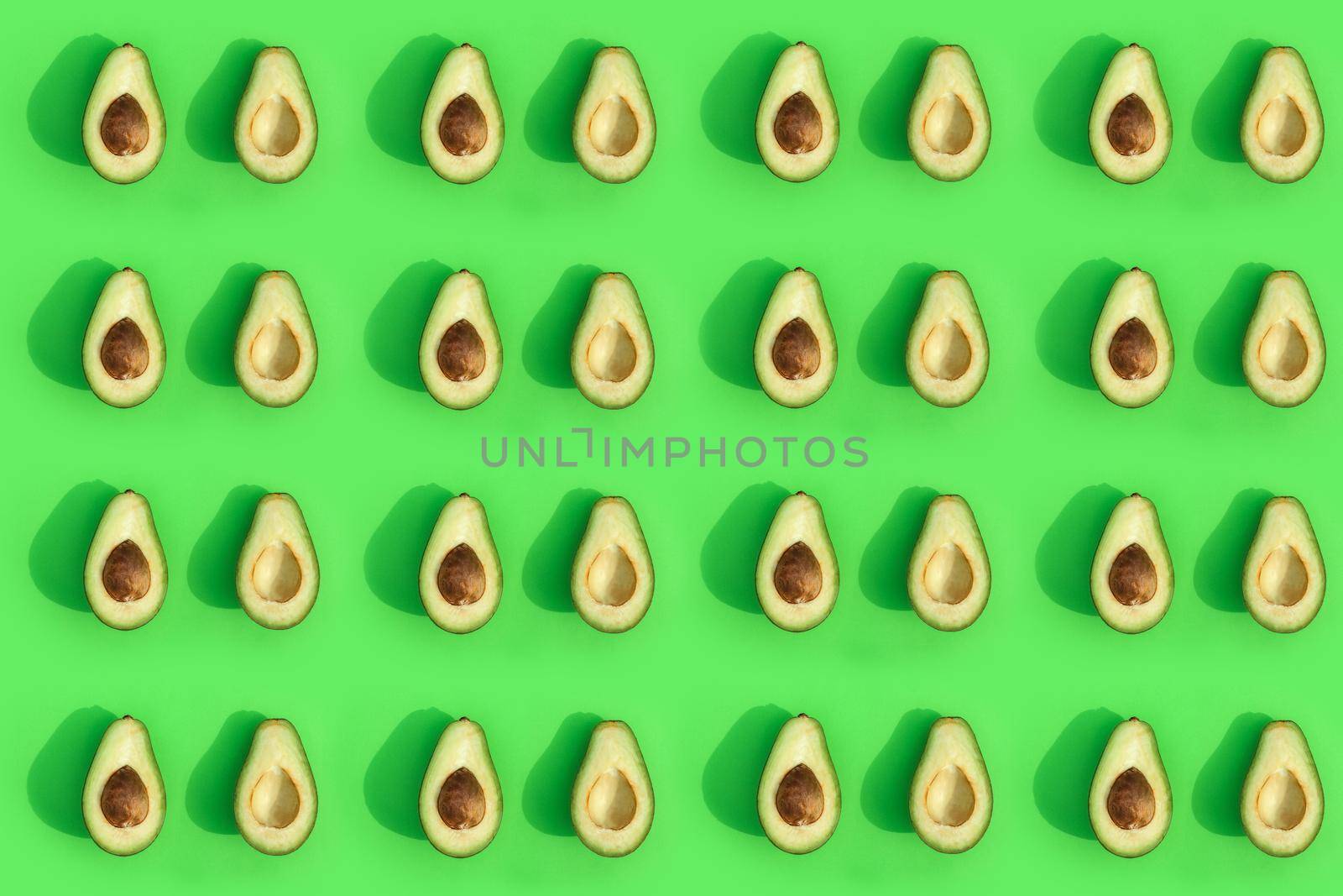 avocado color on a solid background, the top view pattern. High quality photo