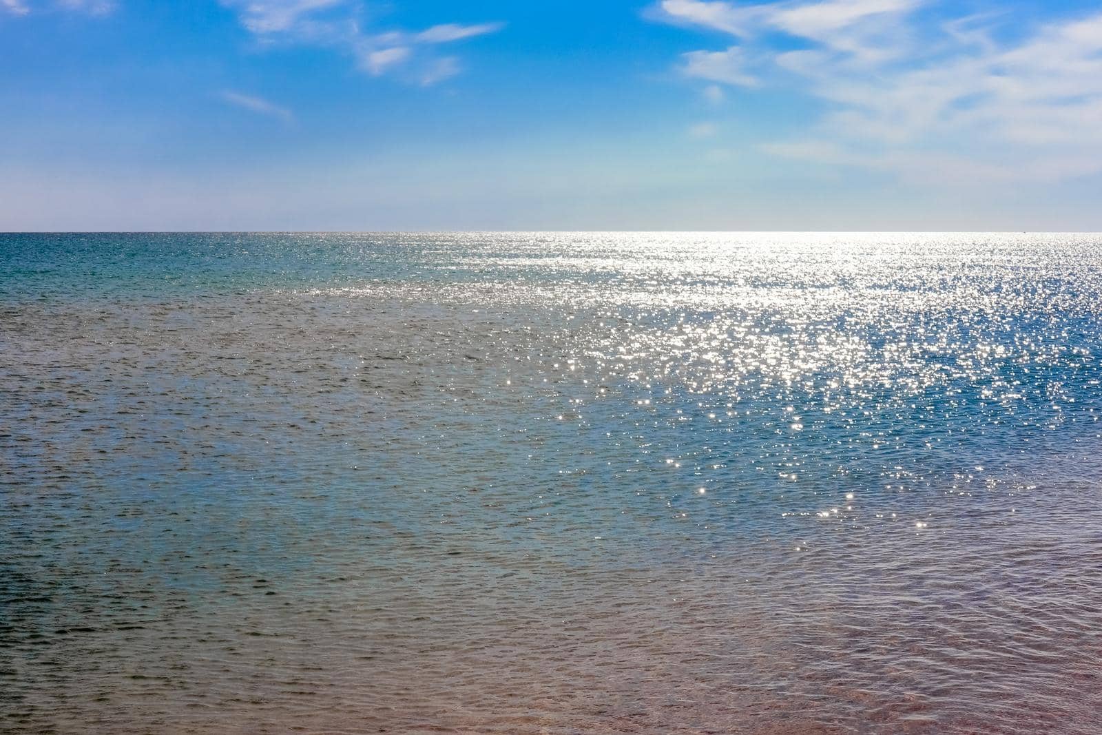 Blue clear sea with waves and sky with clouds. High quality photo