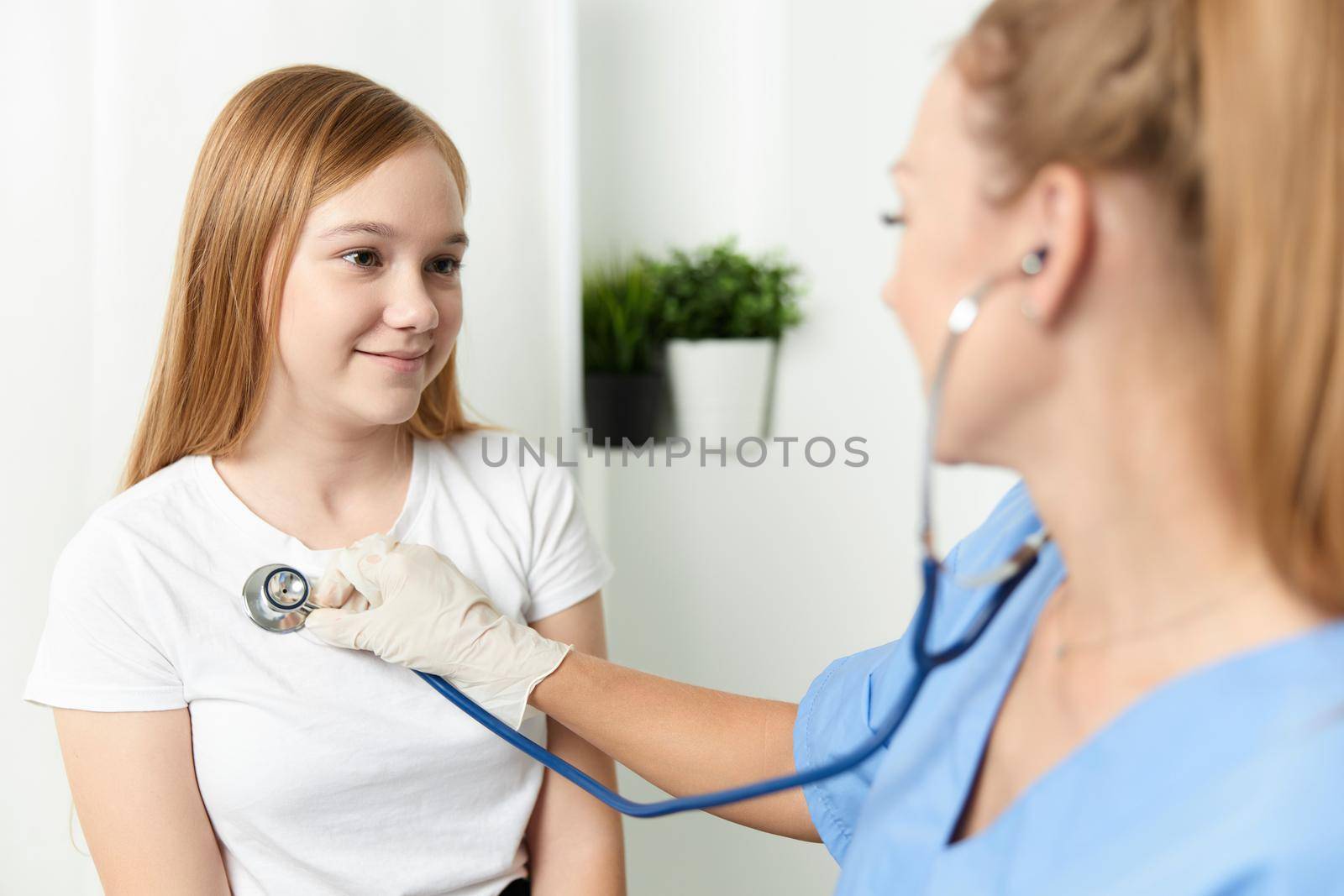 doctor with stethoscope next to the child patient hospital by SHOTPRIME