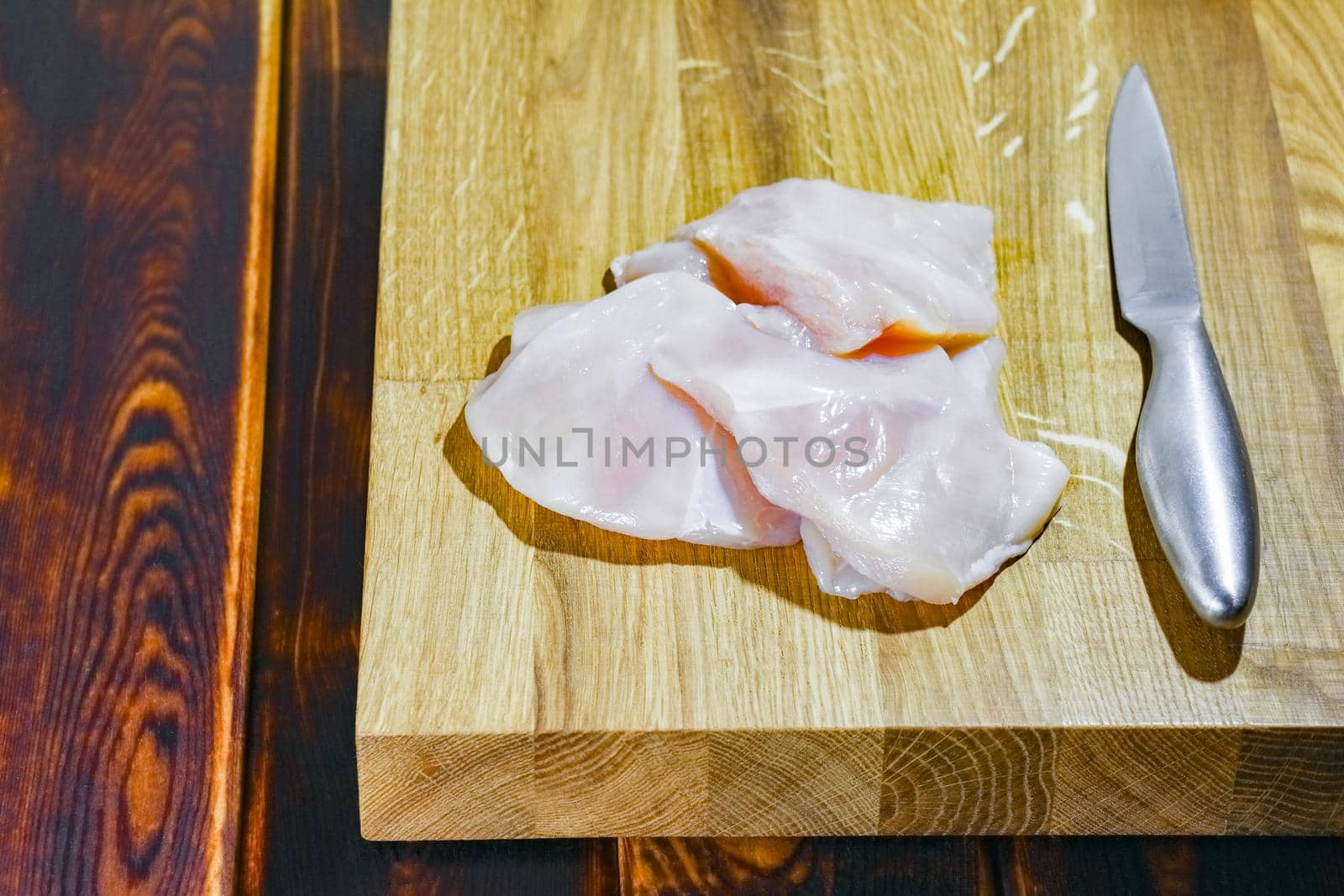 chicken fillet on a cutting Board top view by roman112007