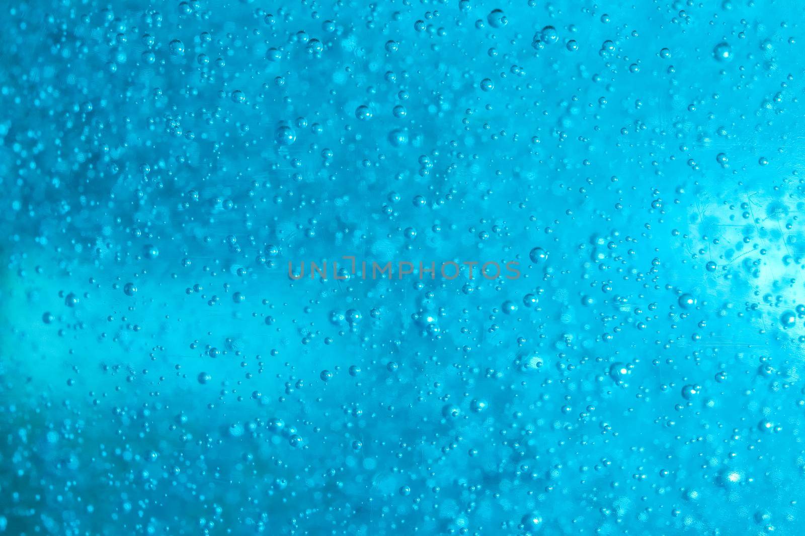 air bubbles in blue shampoos as background. High quality photo