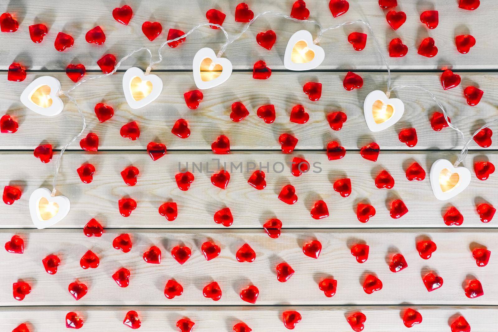 hearts garland on a wooden background top view . High quality photo