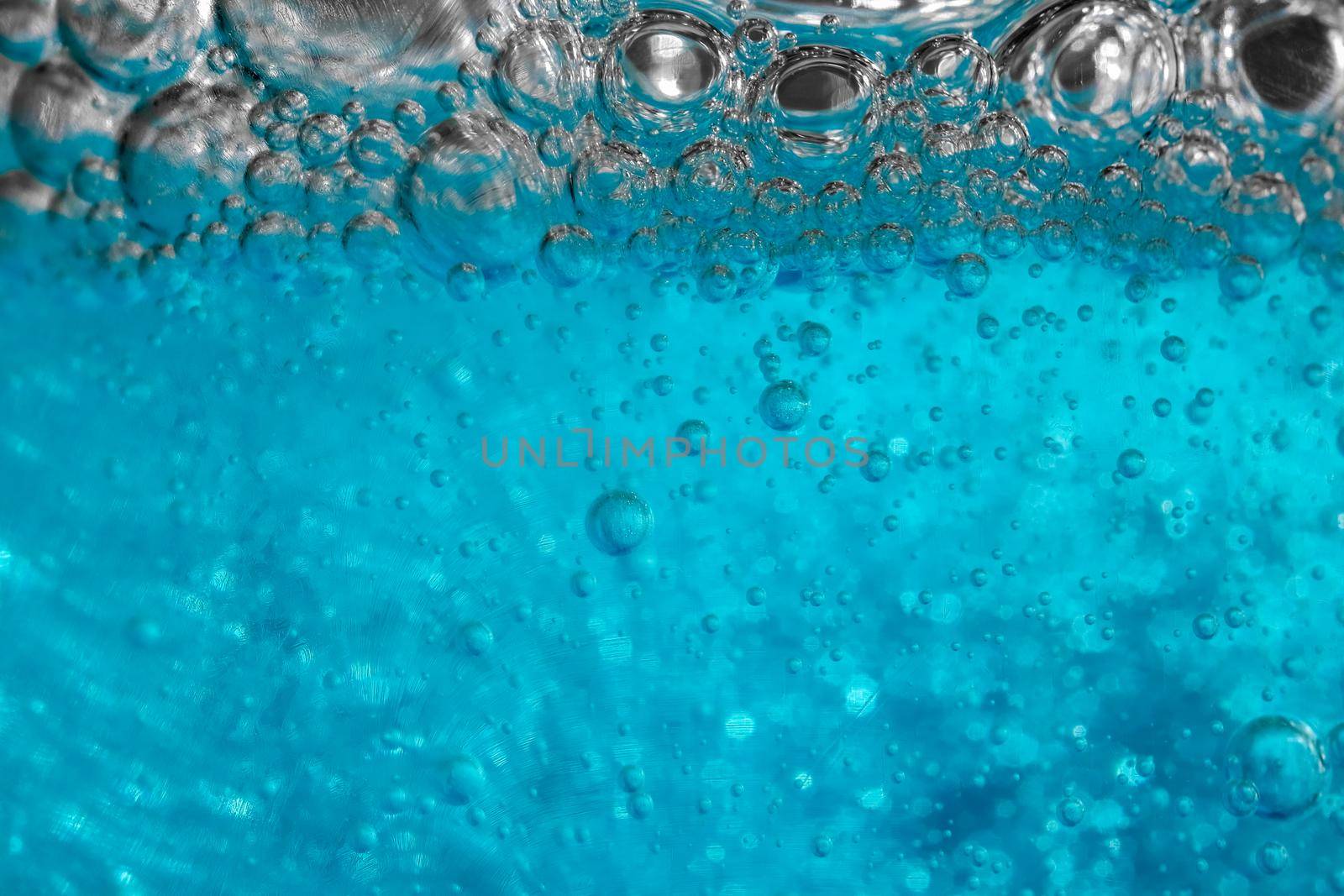 air bubbles in blue shampoos as background. High quality photo