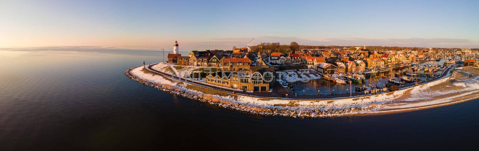 Panoramic view at the lighthouse of Urk Flevoland Netherlands, Urk during winter with white snow covered the beach. Winter in the Netherlands