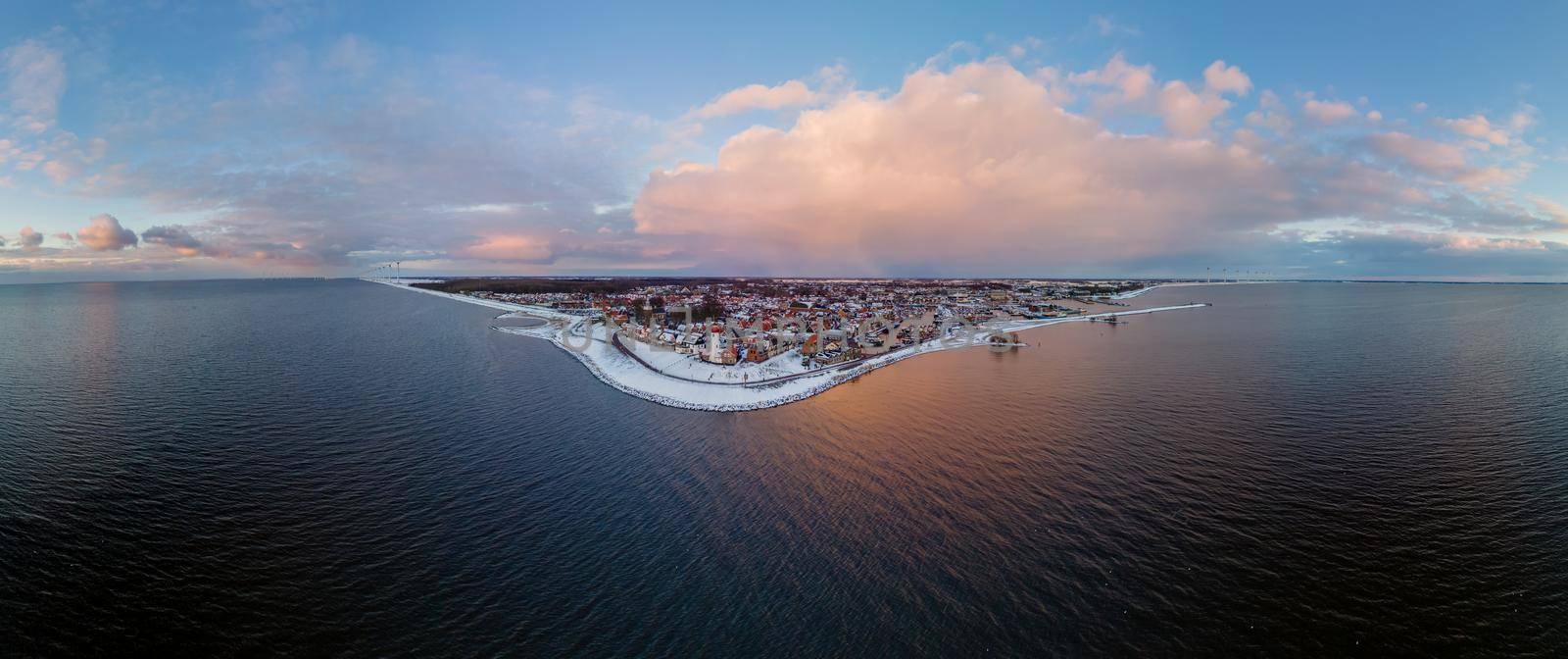 Panoramic view at the lighthouse of Urk Flevoland Netherlands, Urk during winter with white snow covered the beach by fokkebok