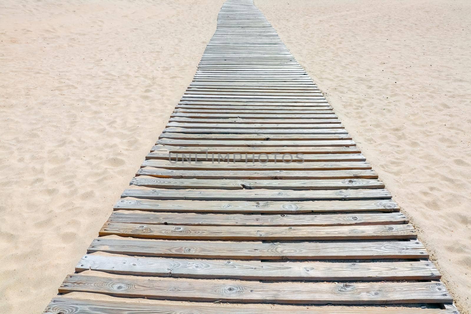 wooden path on the beach dune sand. High quality photo