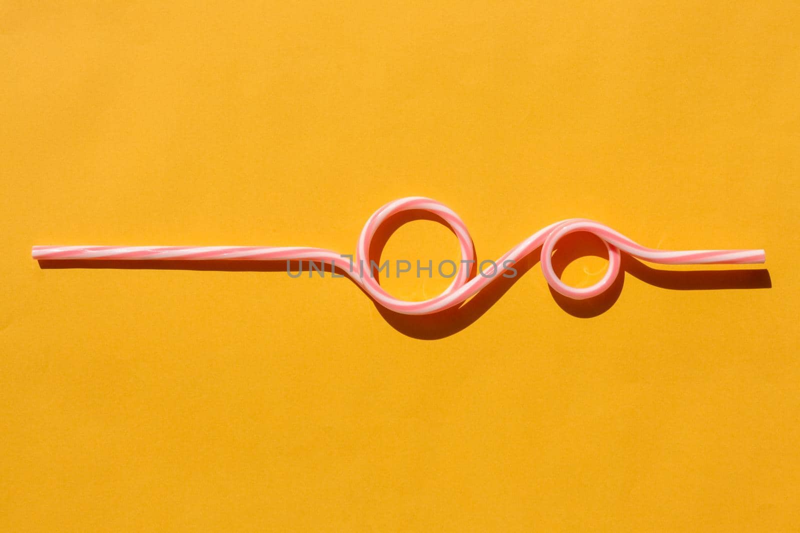 tubes for drinks on a yellow background macro. place for the label. High quality photo