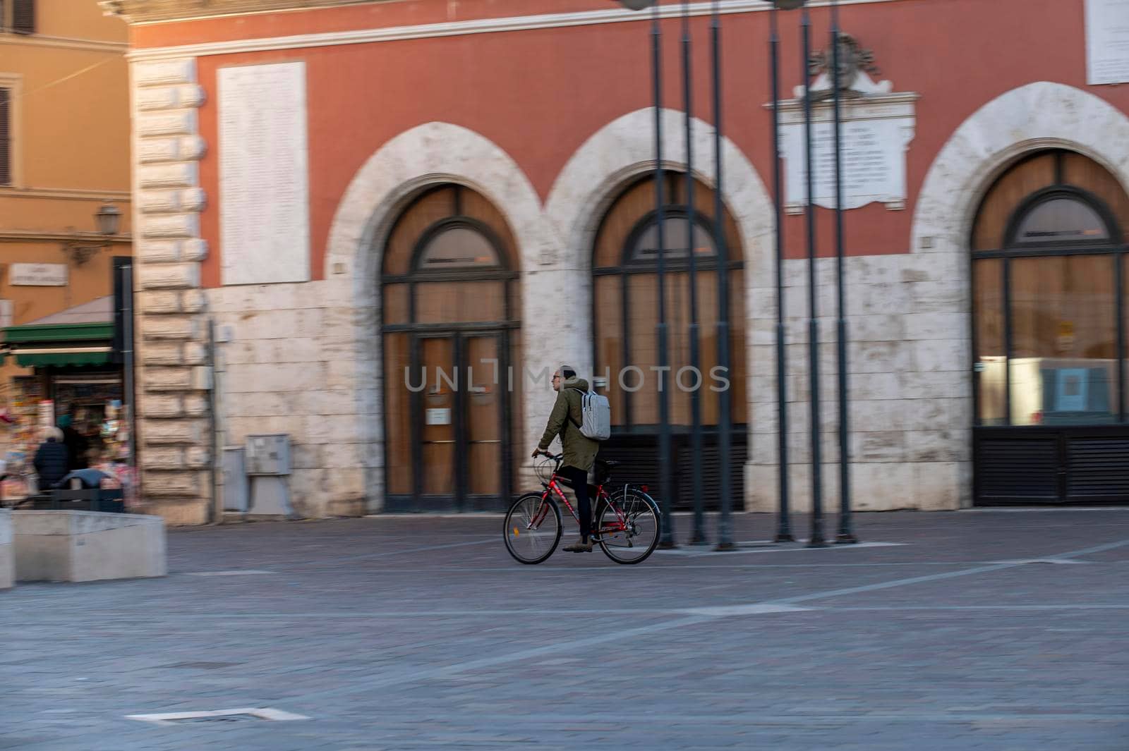 terni,italy february 15 2021:man riding a bicycle to the city center