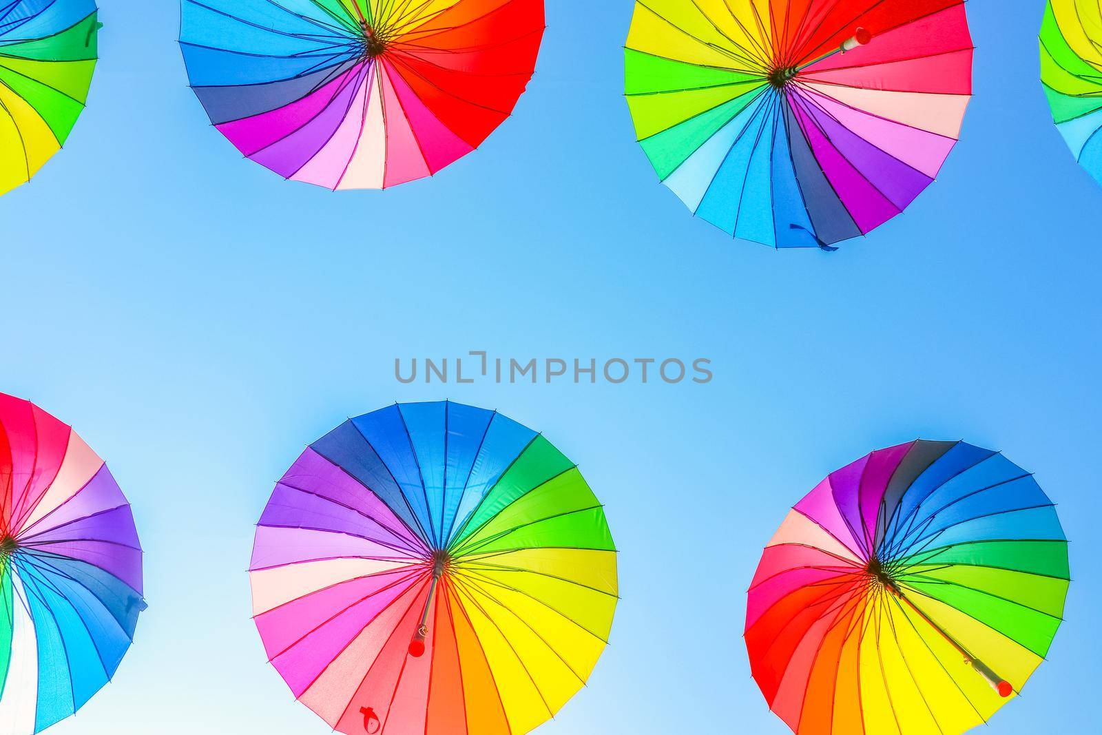 colorful umbrellas against the blue sky. High quality photo