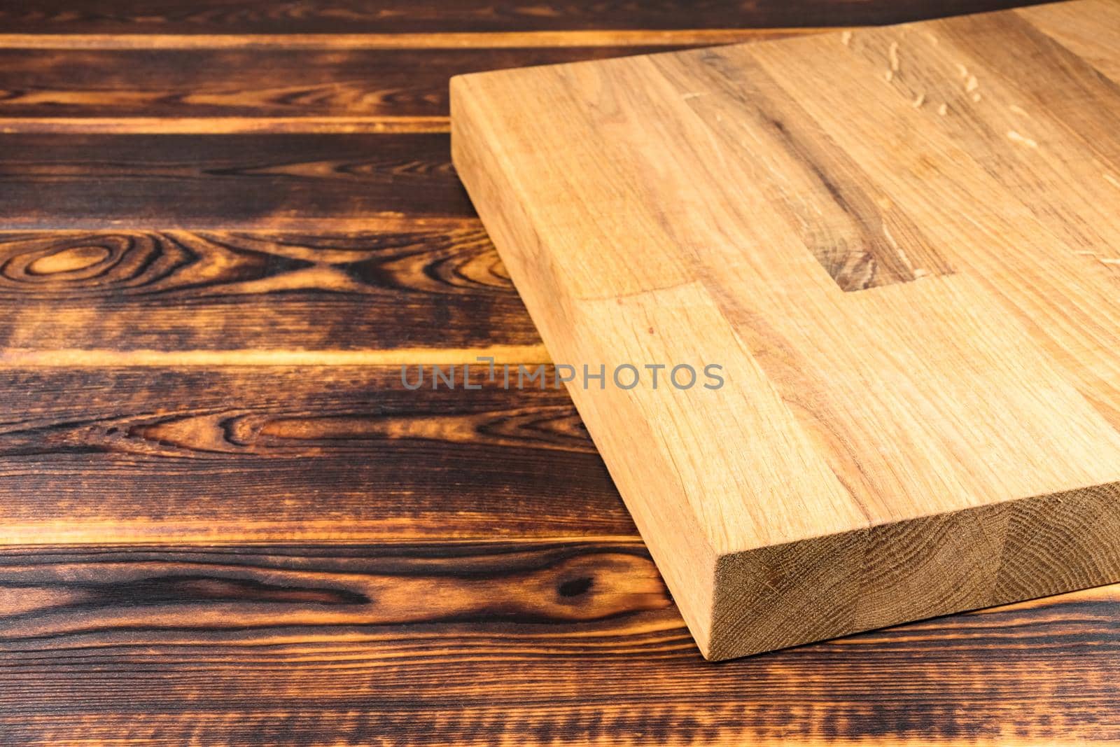 cutting Board on a wooden background top view by roman112007