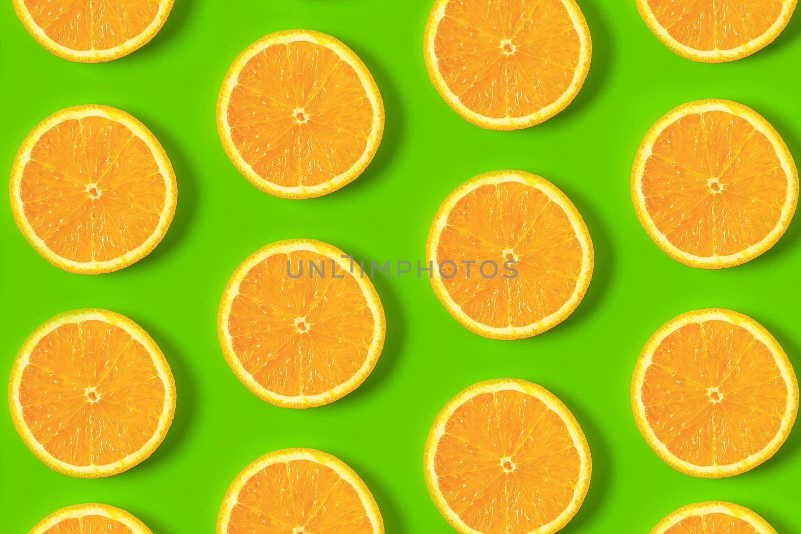 colorful pattern of orange slices on a colorful background top view. High quality photo