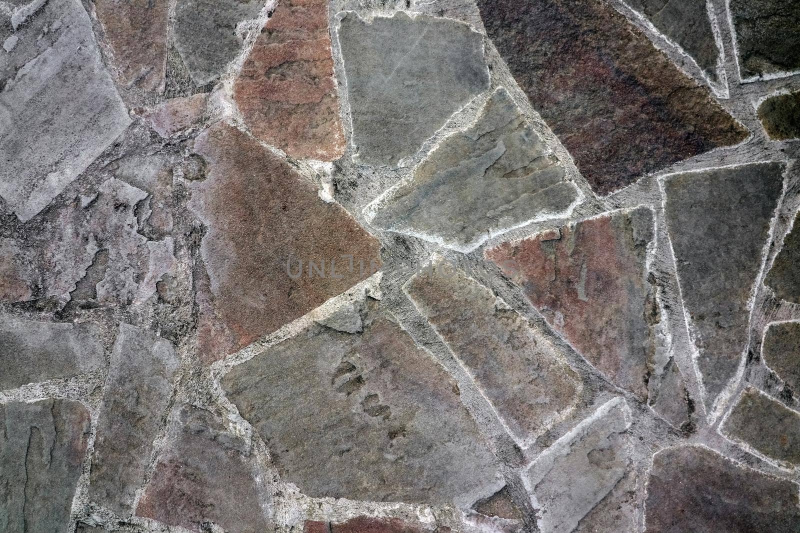 masonry wall paving stones as a background close up by roman112007