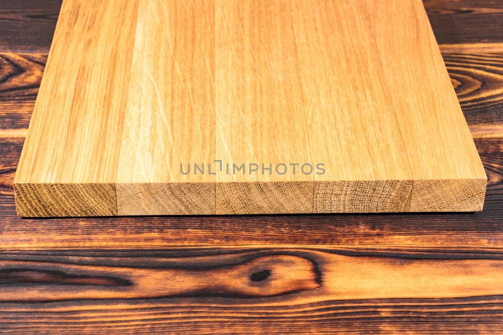 cutting Board on a wooden background top view by roman112007