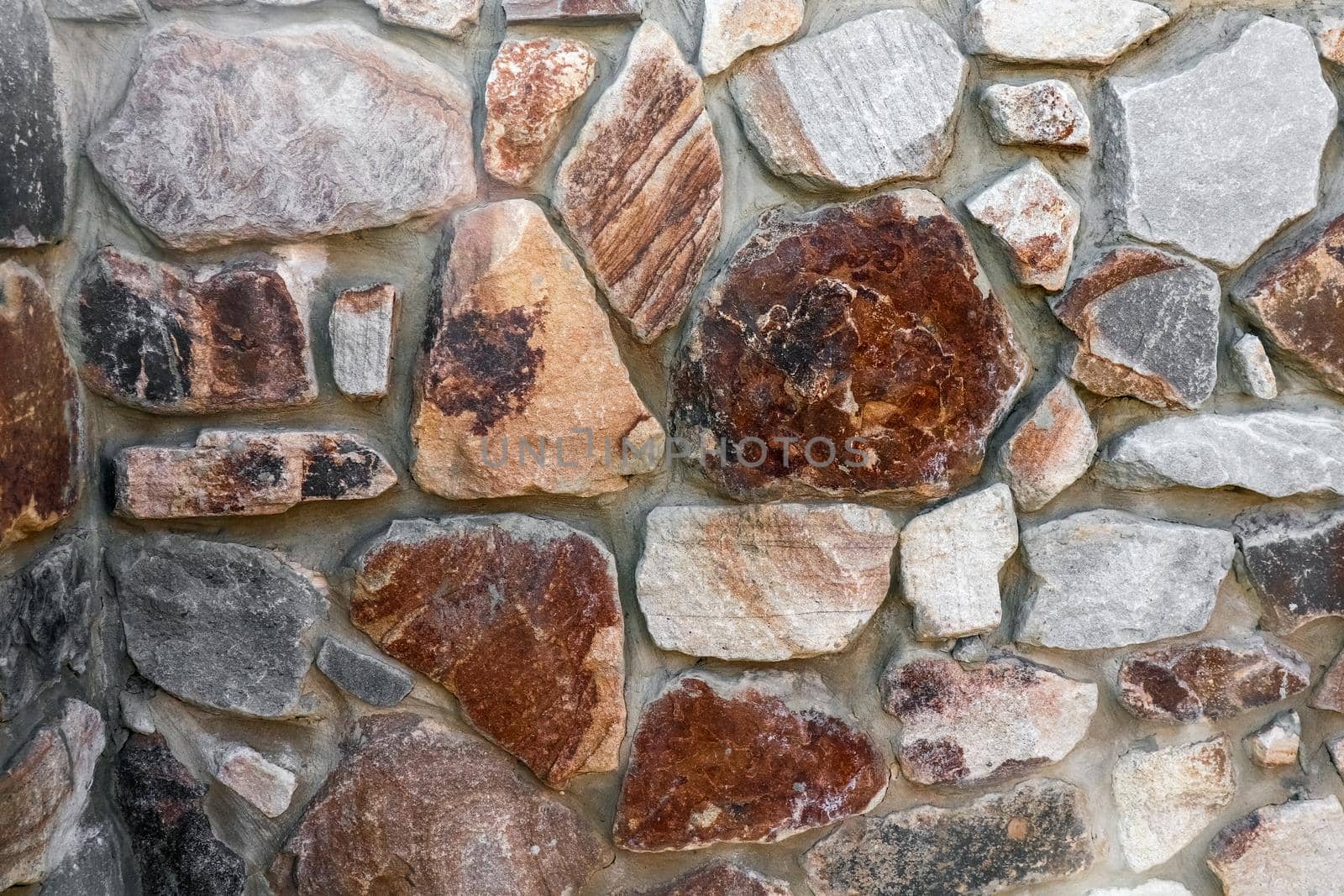 masonry wall paving stones as a background close up by roman112007