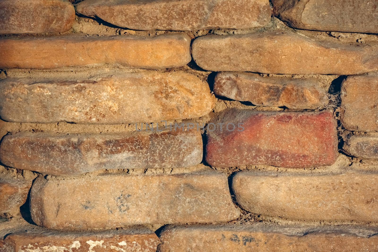 masonry wall paving stones as a background close up by roman112007